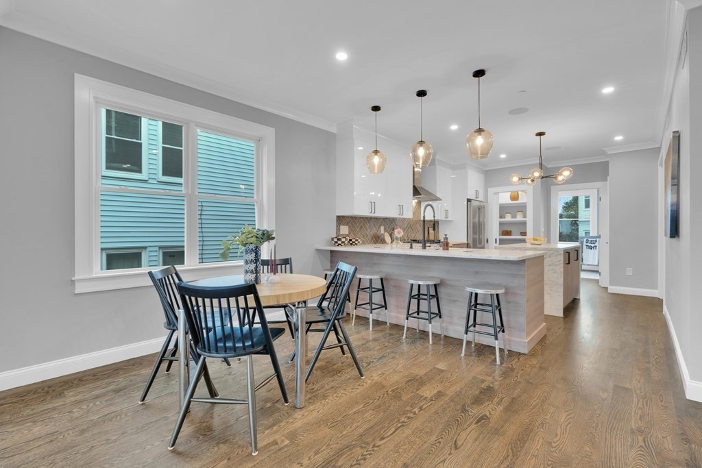 87 Parkton Road, Unit 3 Boston, MA 02130 - Photo 8 of 38 a view of a dining room with furniture and wooden floor