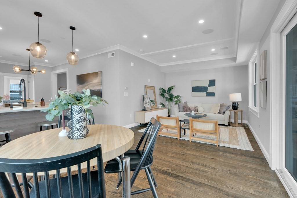 87 Parkton Road, Unit 3 Boston, MA 02130 - Photo 9 of 38 a view of a dining room with furniture window and wooden floor