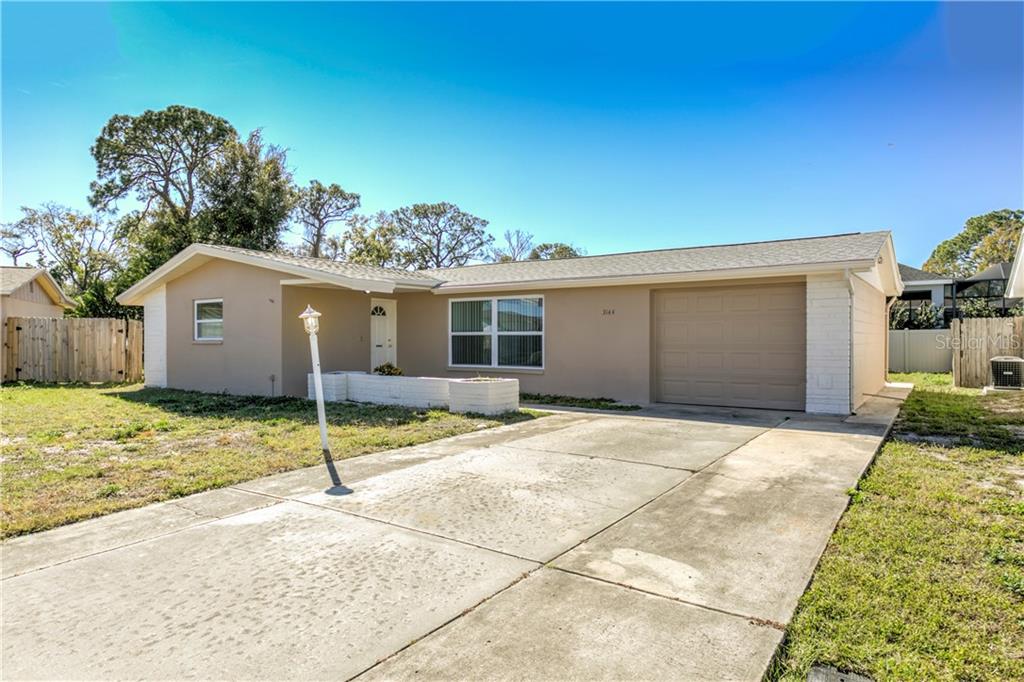 3144 Harvardston Loop Holiday, FL 34691 - Photo 1 of 1 a view of a house with a backyard
