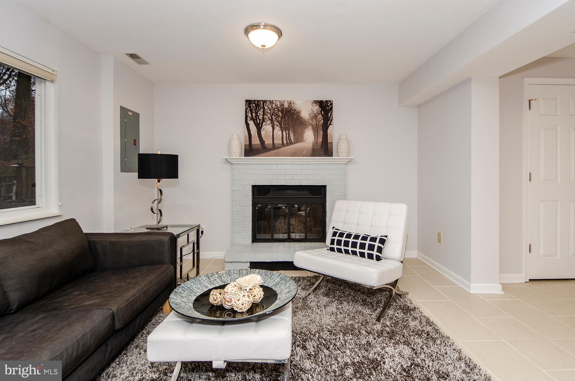 2351 Middle Creek Lane Reston, VA 20191 - Photo 22 of 27 Family room w/ full windows and fireplace