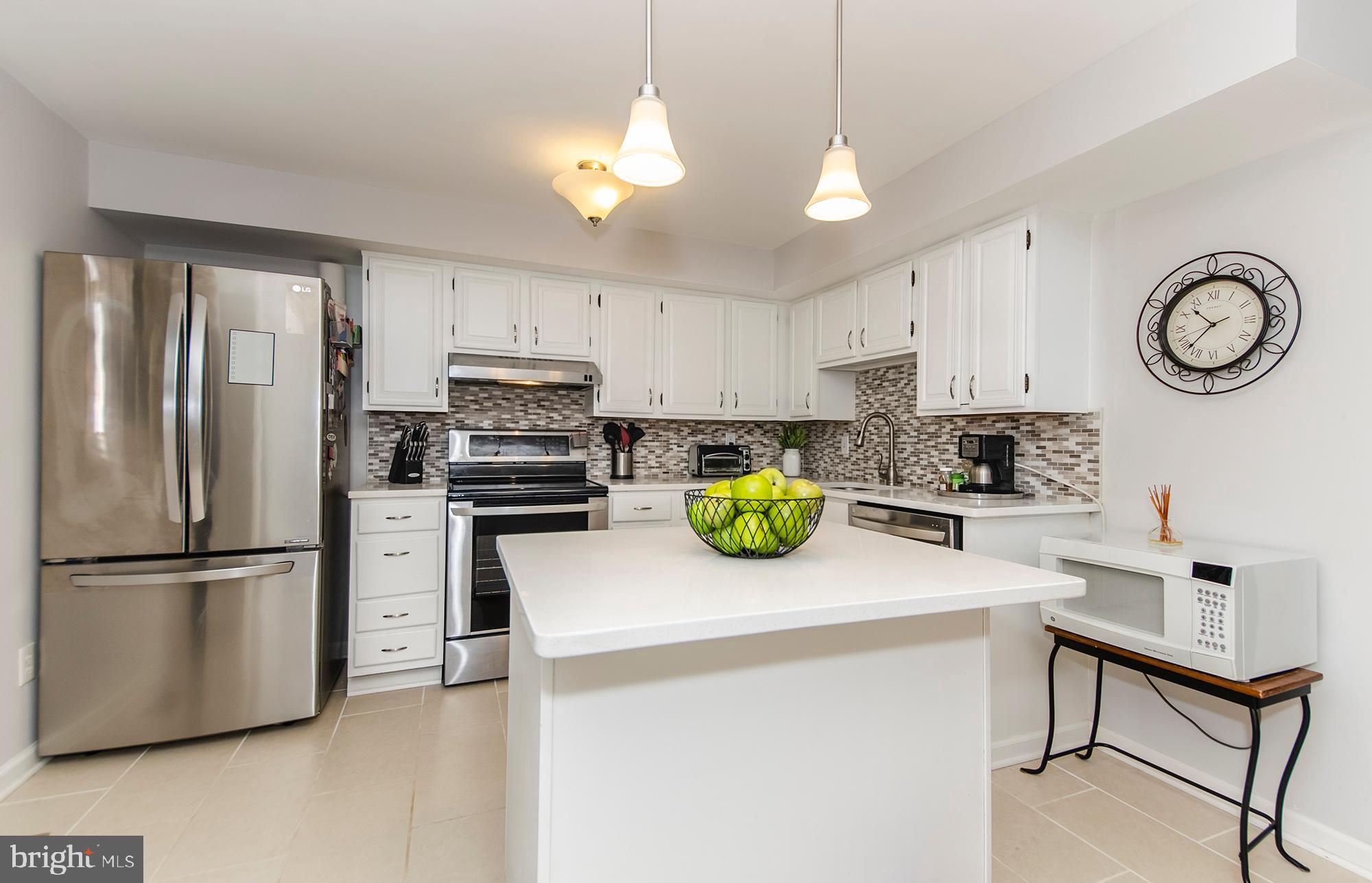 2351 Middle Creek Lane Reston, VA 20191 - Photo 7 of 27 Stainless appliances and gorgeous backsplash