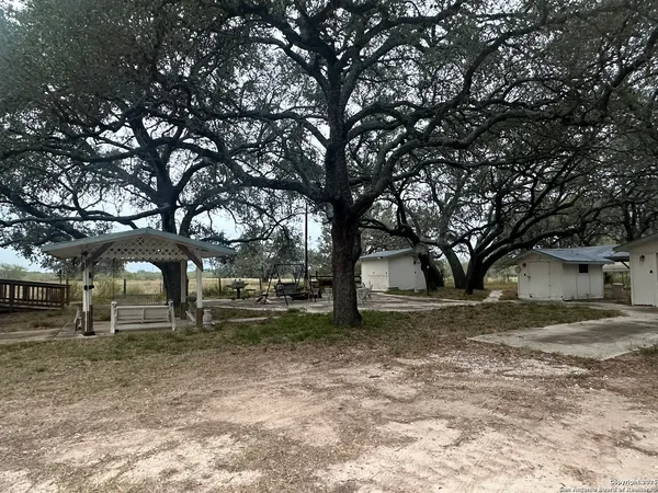 a backyard of a house with lots of trees