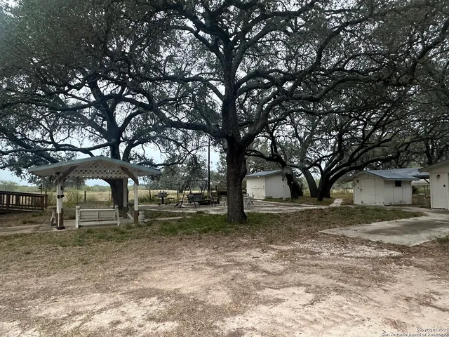 a backyard of a house with lots of trees