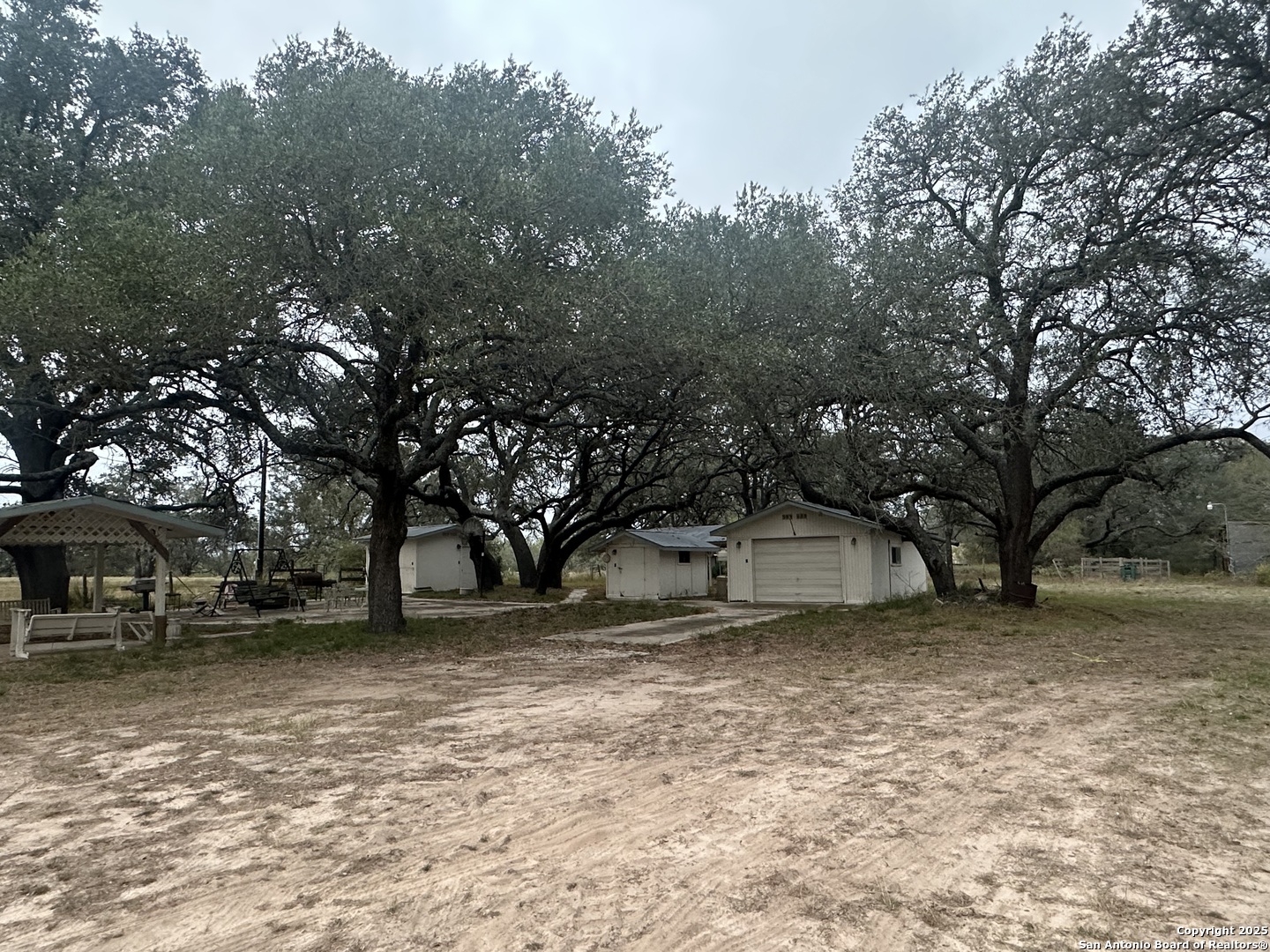 1150 County Road 765 Moore, TX 78057 - Photo 3 of 18 a view of a yard with a house