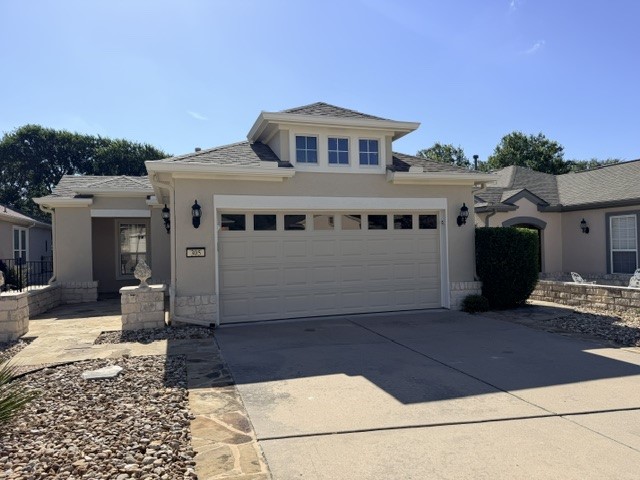 305 Mill Pond Path Georgetown, TX 78633 - Photo 1 of 2 A welcoming façade with a neutral stucco finish and stone accents creates inviting curb appeal.