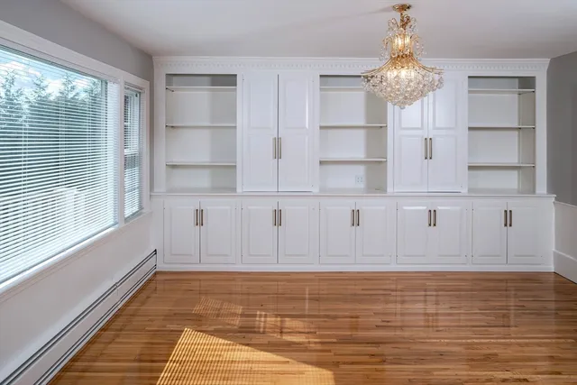 a view of kitchen with wooden floor and windows