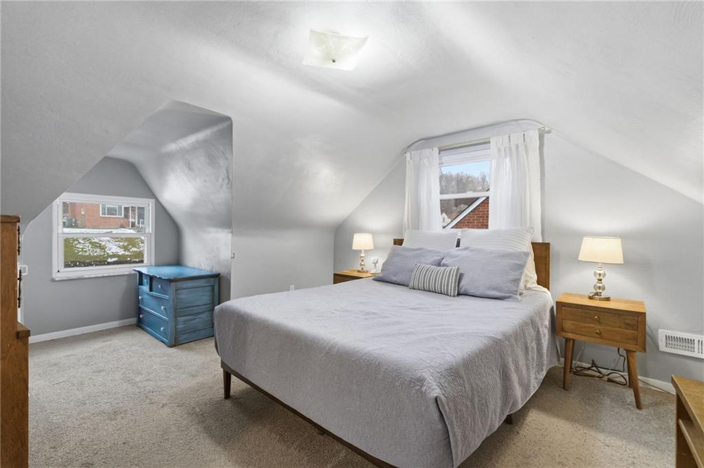 870 Middle Road Pittsburgh, PA 15234 - Photo 18 of 34 a bedroom with a bed and wooden floor