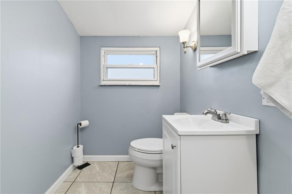 870 Middle Road Pittsburgh, PA 15234 - Photo 23 of 34 a bathroom with a sink toilet and a mirror