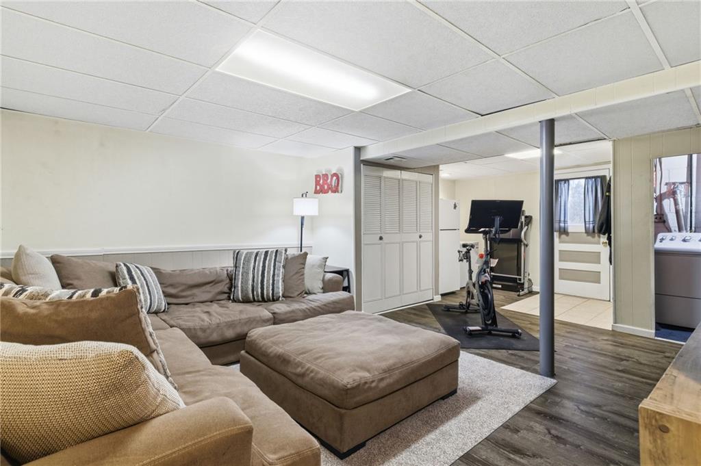 870 Middle Road Pittsburgh, PA 15234 - Photo 24 of 34 a living room with furniture and a flat screen tv