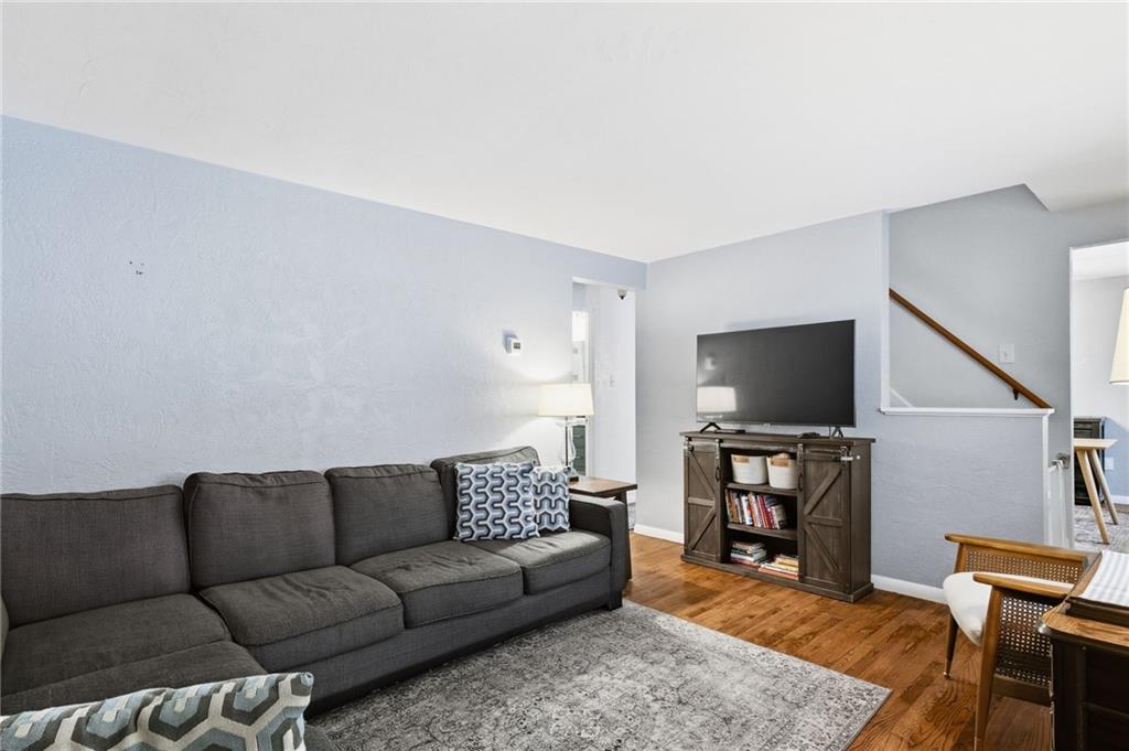 870 Middle Road Pittsburgh, PA 15234 - Photo 3 of 34 a living room with furniture and a flat screen tv