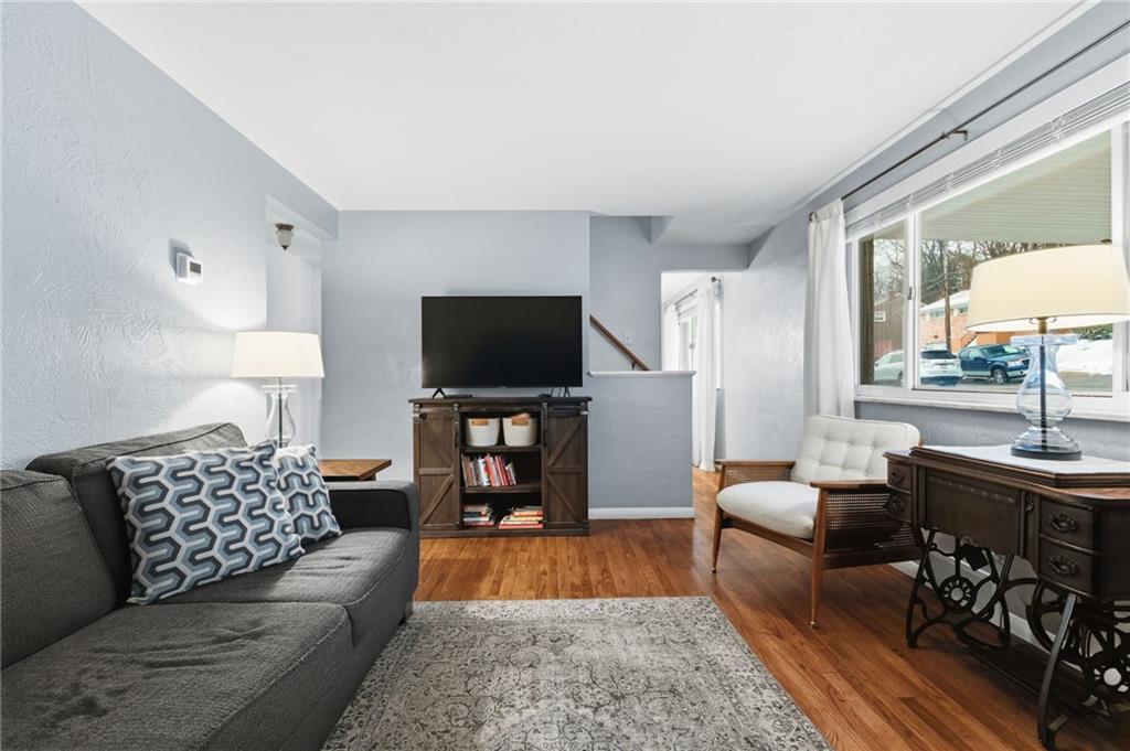 870 Middle Road Pittsburgh, PA 15234 - Photo 4 of 34 a living room with furniture and a flat screen tv