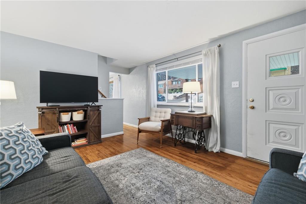 870 Middle Road Pittsburgh, PA 15234 - Photo 5 of 34 a living room with furniture and a flat screen tv
