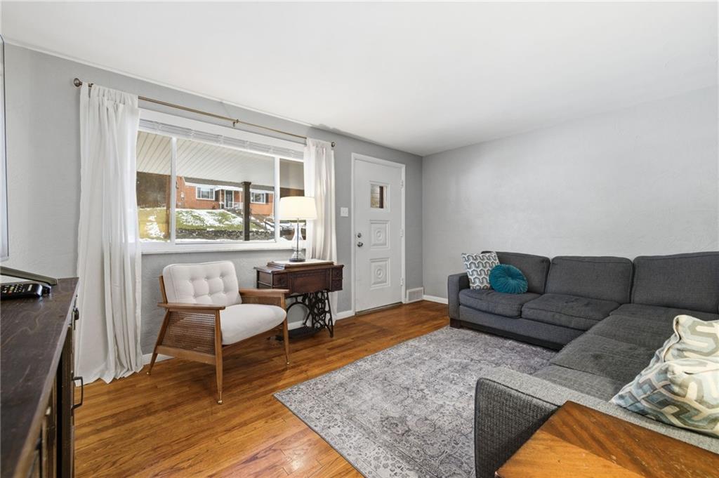 870 Middle Road Pittsburgh, PA 15234 - Photo 6 of 34 a living room with furniture and a table