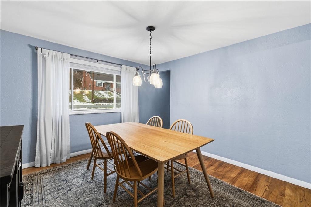870 Middle Road Pittsburgh, PA 15234 - Photo 9 of 34 a view of a dining room with a table and chairs