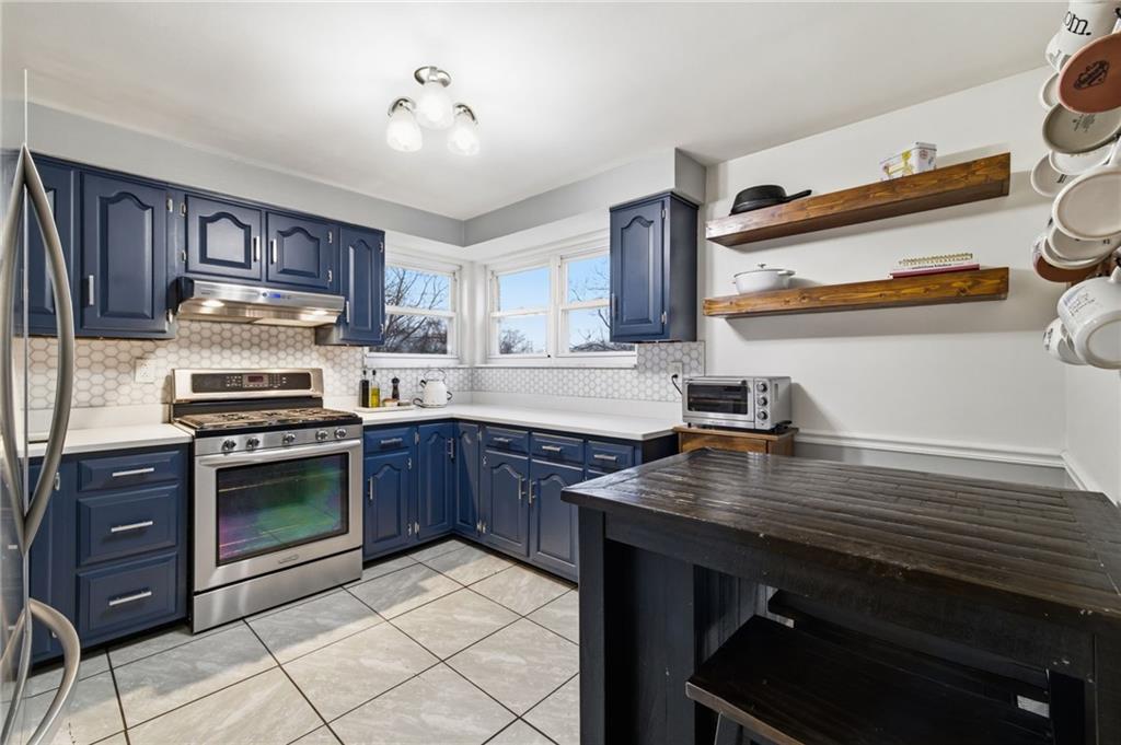 870 Middle Road Pittsburgh, PA 15234 - Photo 10 of 34 a kitchen with a stove and a sink