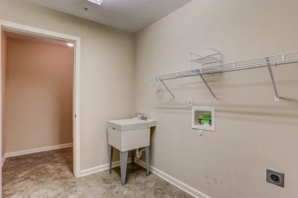 a view of a room with a table and chairs