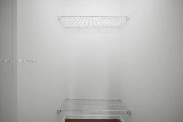 a view of a balcony with a tree