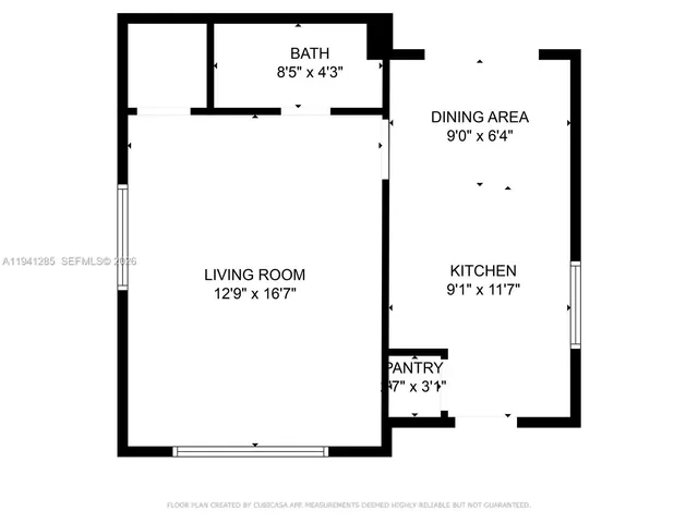 a kitchen with appliances a sink and cabinets