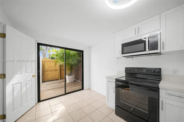 a kitchen with a stove and a microwave