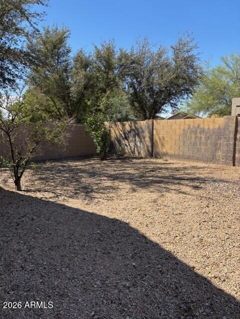 5624 West Vineyard Road Laveen, AZ 85339 - Photo 2 of 9 NICE SIZE BACKYARD BLOCK FENCE TO BE PAI