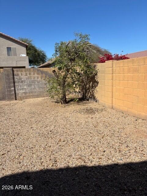 5624 West Vineyard Road Laveen, AZ 85339 - Photo 5 of 9 BACKYARD FENCE GETTING PAINTED SUMMER 20