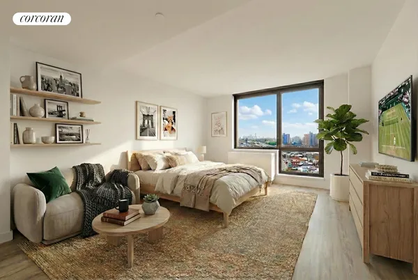 a spacious bedroom with furniture and a large window