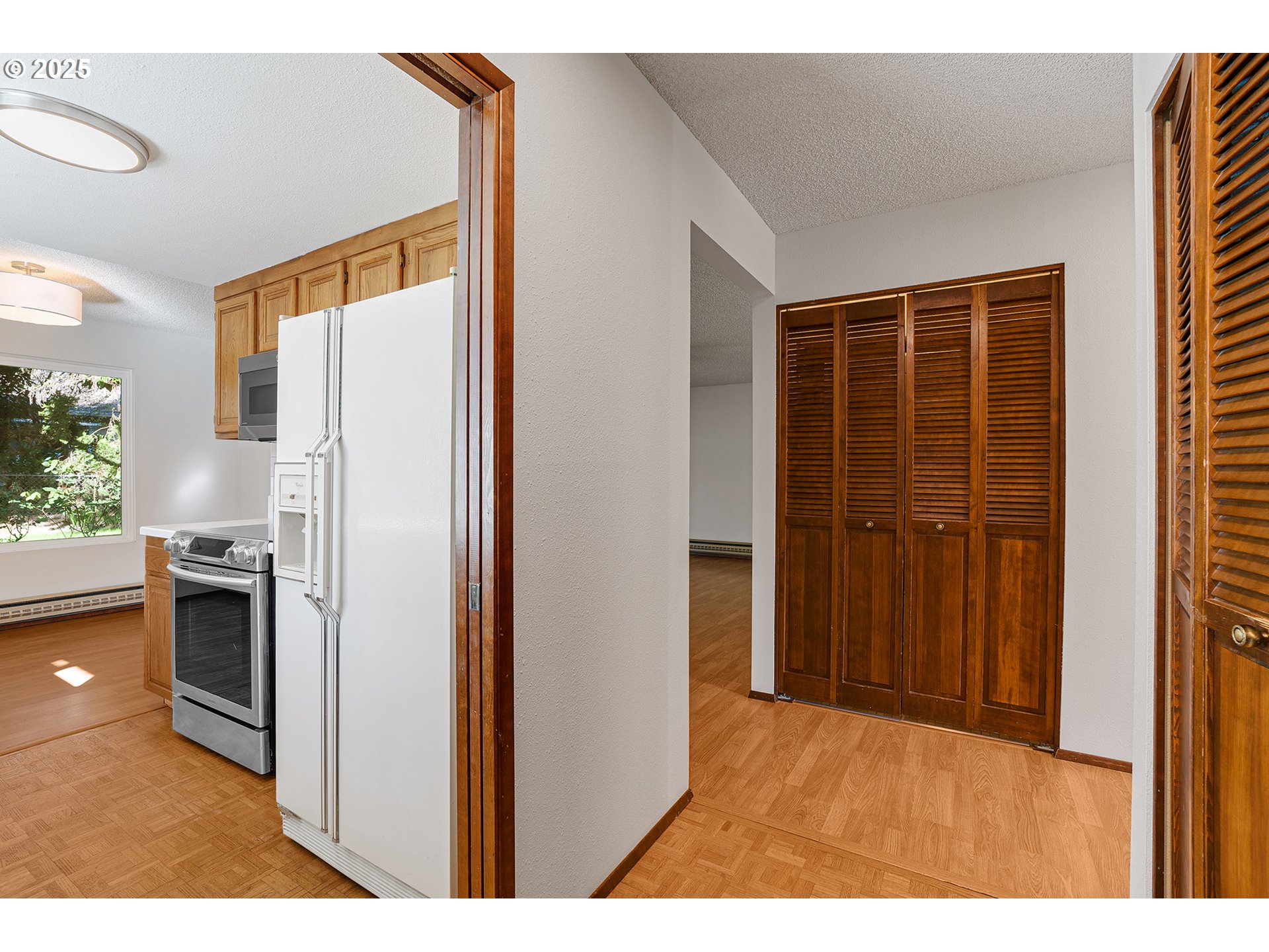 10915 Southwest Meadowbrook Drive, Unit 22 Portland, OR 97224 - Photo 5 of 23 a view of a kitchen from the hallway