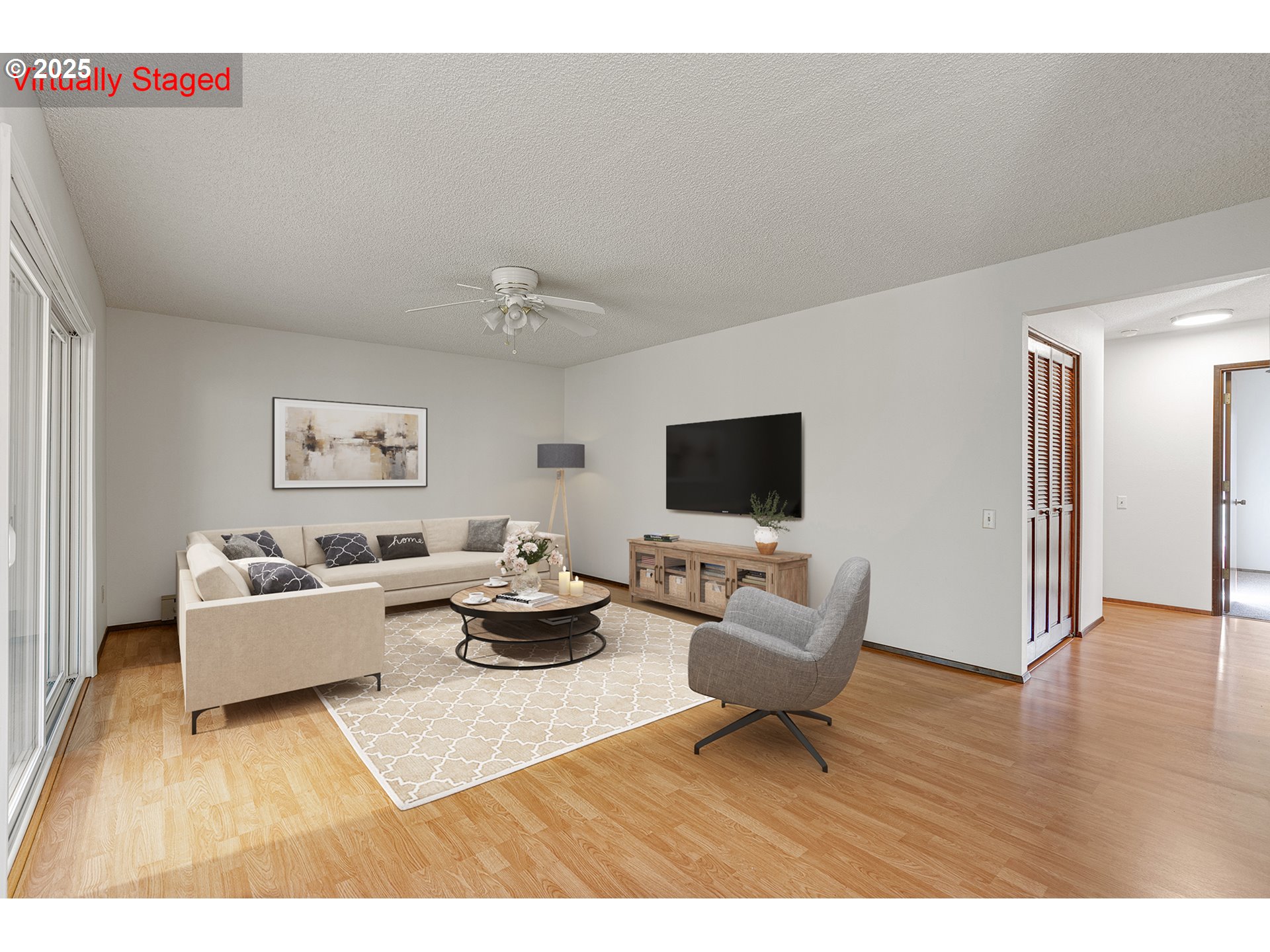 10915 Southwest Meadowbrook Drive, Unit 22 Portland, OR 97224 - Photo 10 of 23 a living room with furniture and a flat screen tv