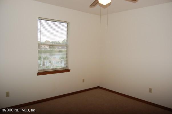1741 Derringer Road Jacksonville, FL 32225 - Photo 3 of 13 an empty room with a window
