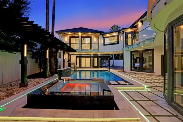 a view of an outdoor space pool patio and dining room