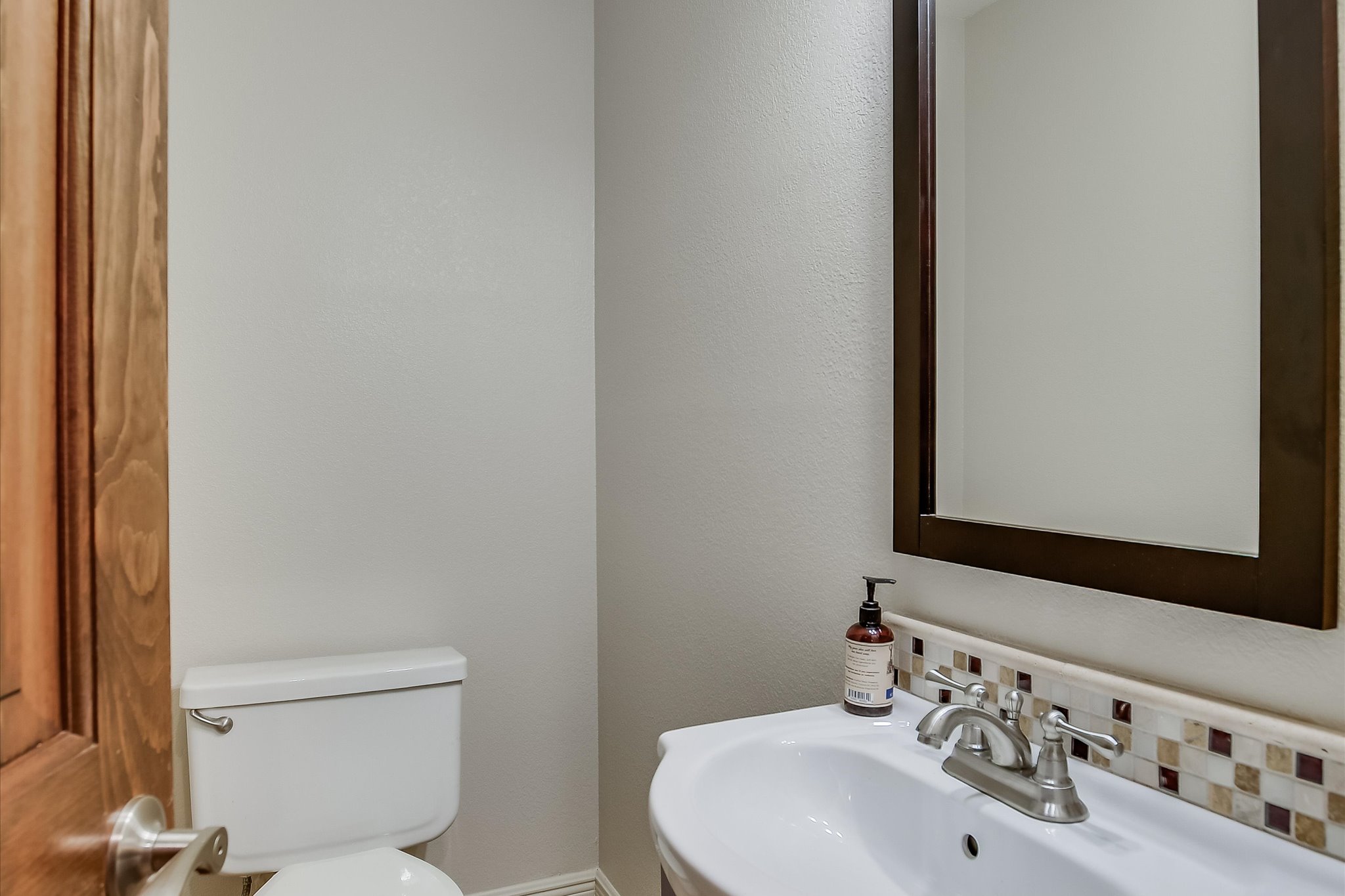 328 Fawnridge Street Georgetown, TX 78628 - Photo 12 of 33 Half bathroom on main level near living room for convenient guest use.