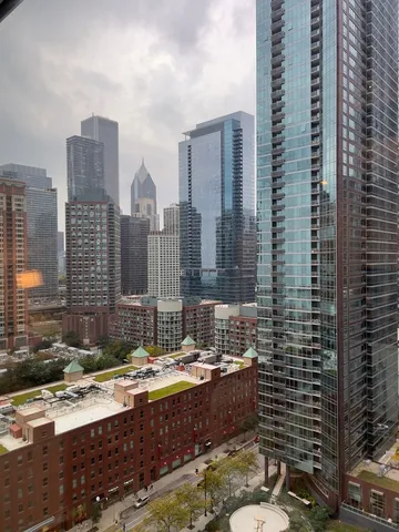 a bathroom with a granite countertop sink and a bathtub