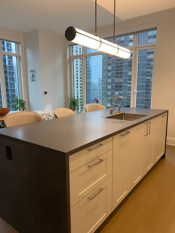 a kitchen with a sink and cabinets