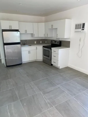 a view of room with window and screen