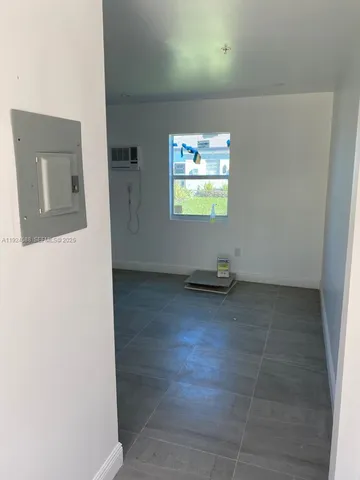 a view of an empty room with a window