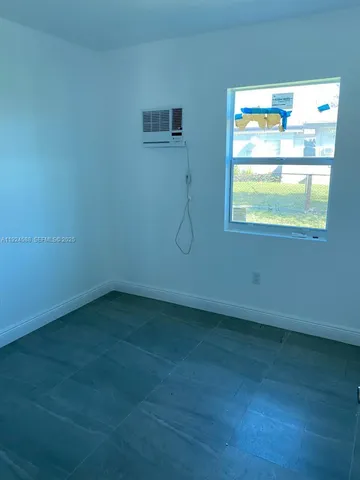 a bathroom with a toilet sink a mirror and bathtub