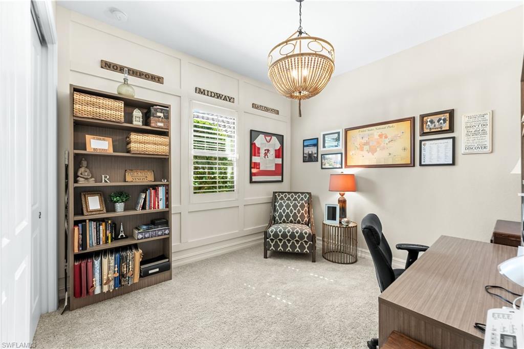 6818 Canwick Cove Circle Naples, FL 34113 - Photo 16 of 44 Carpeted office space with suspended lighting and a decorative wall