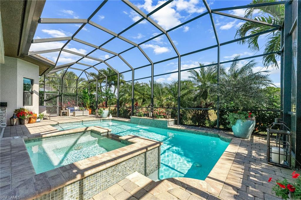 6818 Canwick Cove Circle Naples, FL 34113 - Photo 21 of 44 Relaxing pool / spa with a sunroom, a patio area, and a lanai