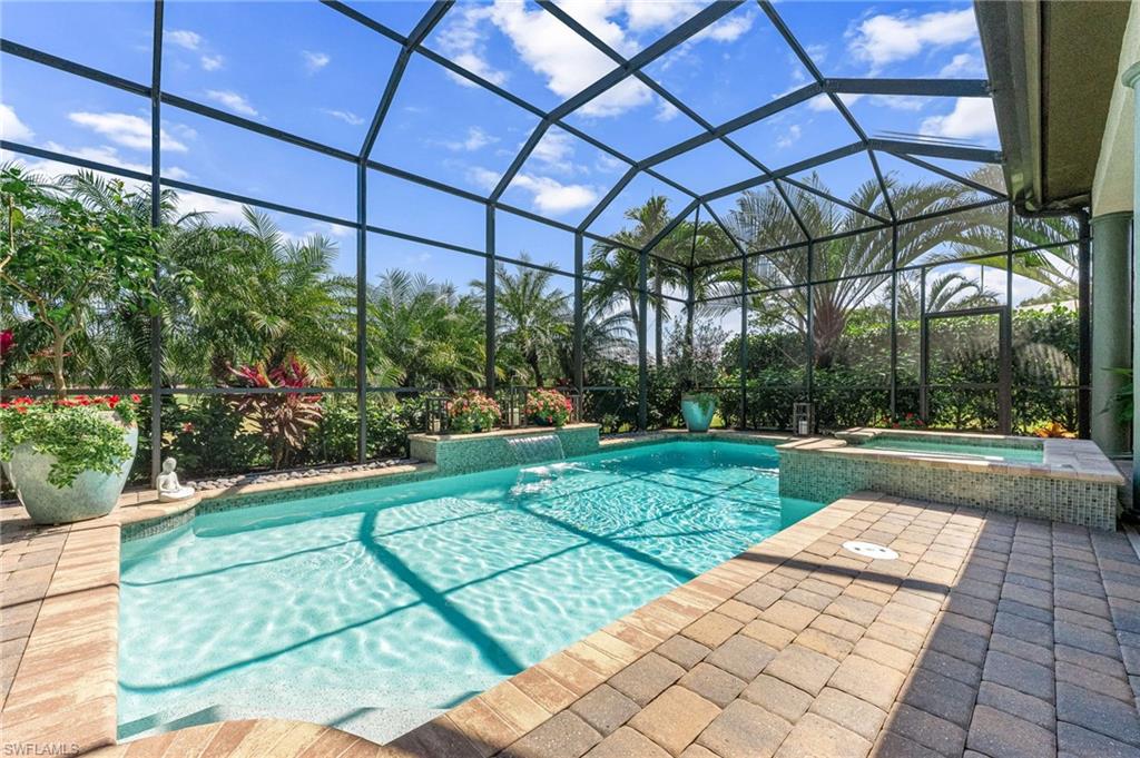 6818 Canwick Cove Circle Naples, FL 34113 - Photo 23 of 44 Integrated pool / spa featuring a sunroom, a lanai, and a patio