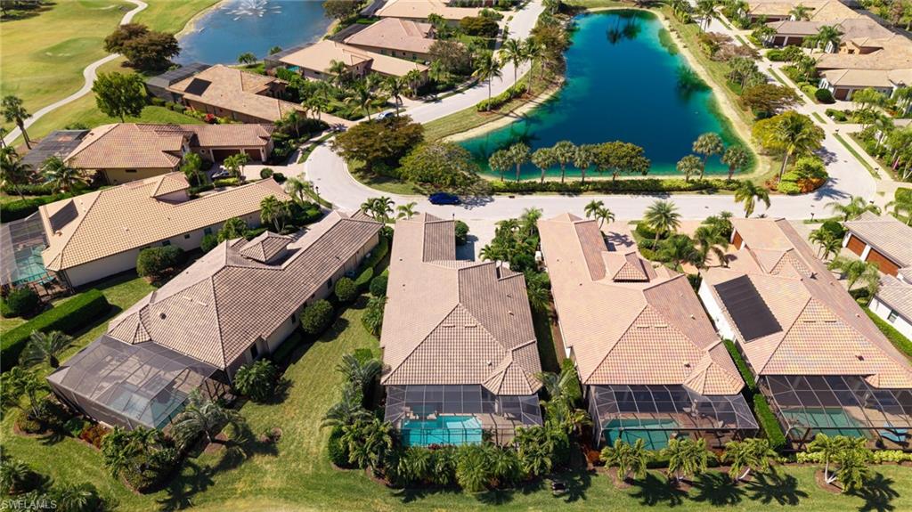 6818 Canwick Cove Circle Naples, FL 34113 - Photo 30 of 44 Aerial view of residential area with a nearby body of water