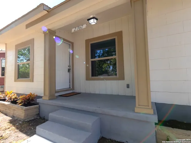 a living room with furniture and window