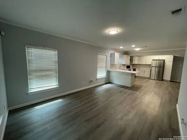 a view of kitchen with white cabinets