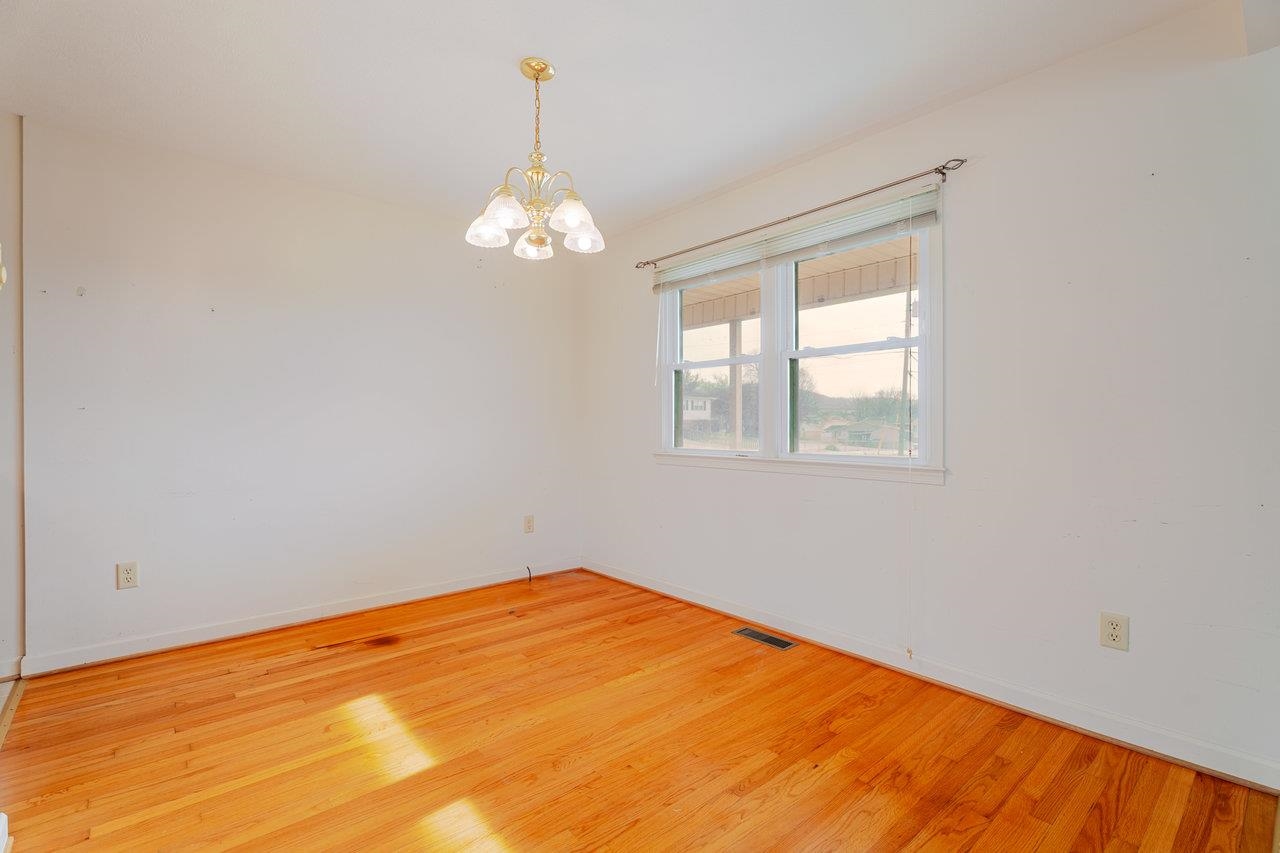 179 3rd Street Broadway, VA 22815 - Photo 18 of 38 a view of empty room with wooden floor and fan