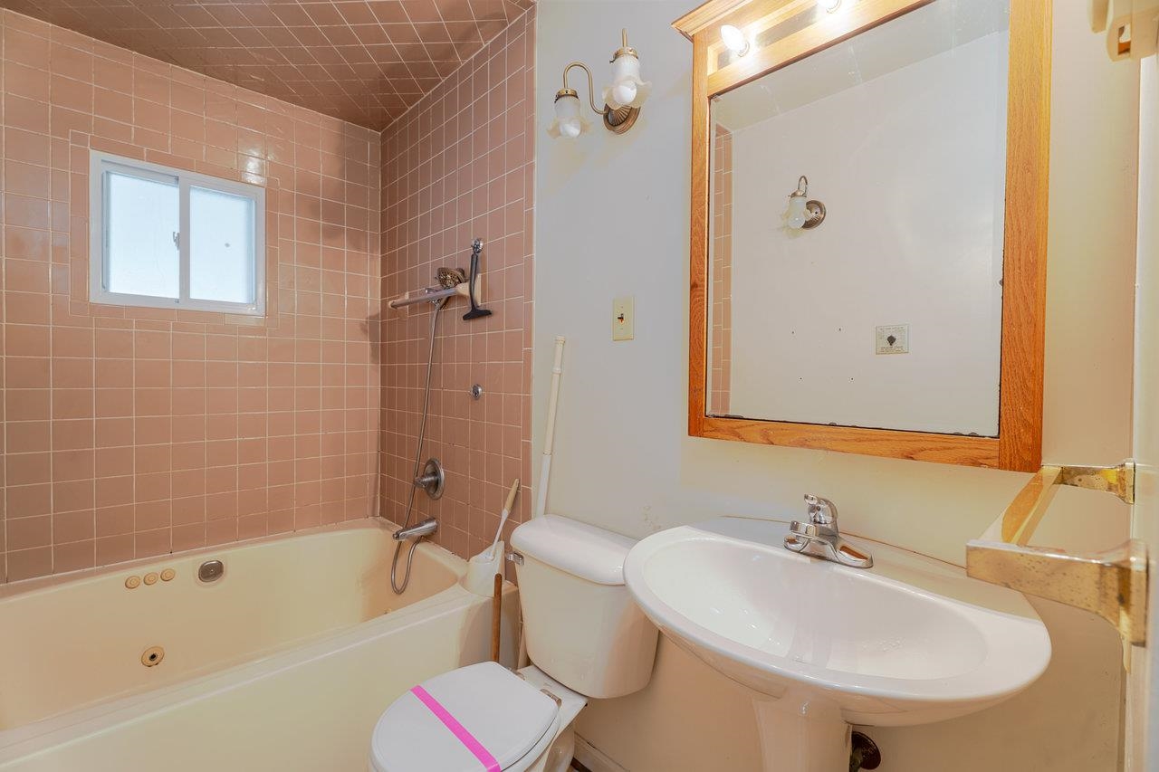 179 3rd Street Broadway, VA 22815 - Photo 19 of 38 a bathroom with a sink toilet and shower