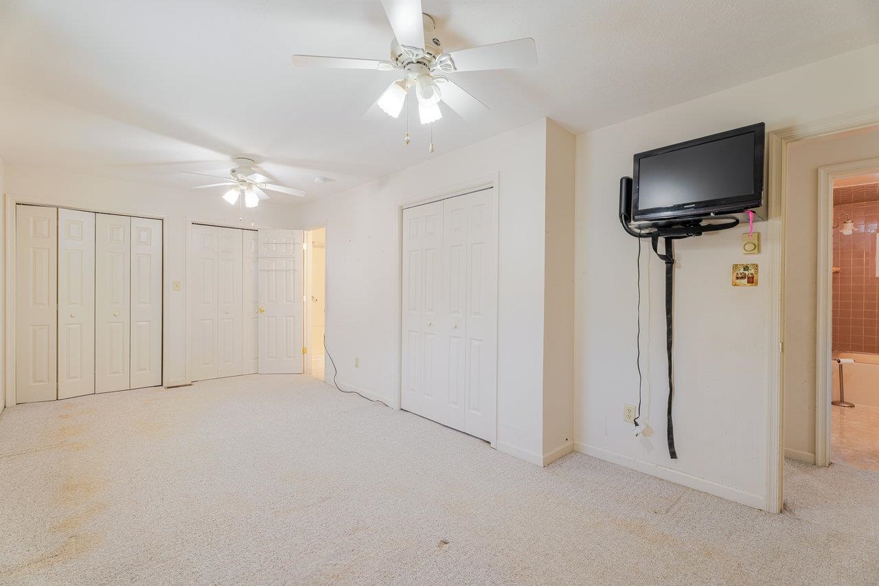 179 3rd Street Broadway, VA 22815 - Photo 20 of 38 a view of an empty room with a ceiling fan and a window