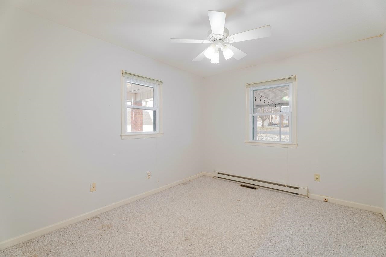 179 3rd Street Broadway, VA 22815 - Photo 23 of 38 an empty room with windows and fan