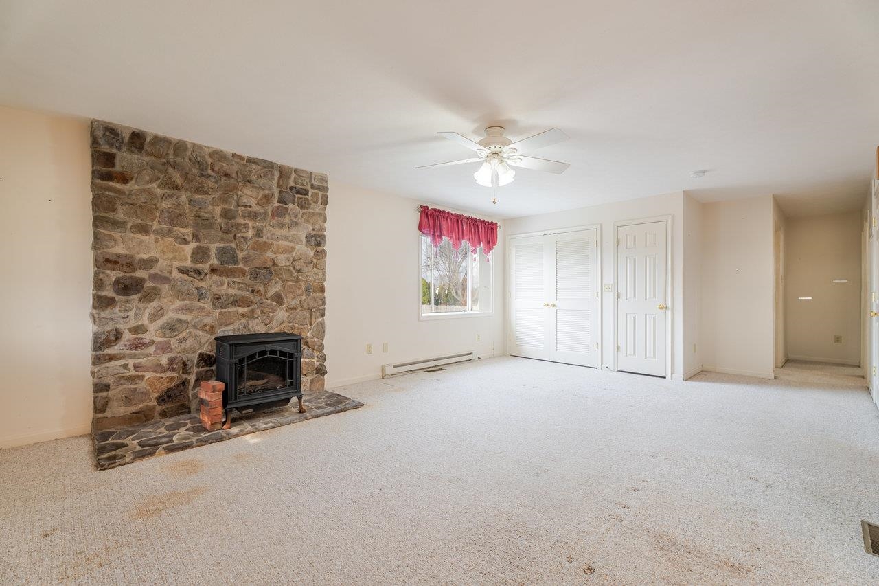 179 3rd Street Broadway, VA 22815 - Photo 10 of 38 an empty room with windows and fireplace