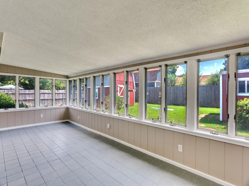 1216 Manning Street Benbrook, TX 76126 - Photo 18 of 26 Unfurnished sunroom featuring a textured ceiling and tile patterned flooring