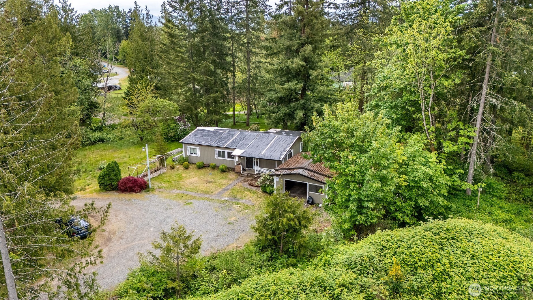 22512 Highway 410 Bonney Lake, WA 98391 - Photo 13 of 18 an aerial view of a house with swimming pool and garden
