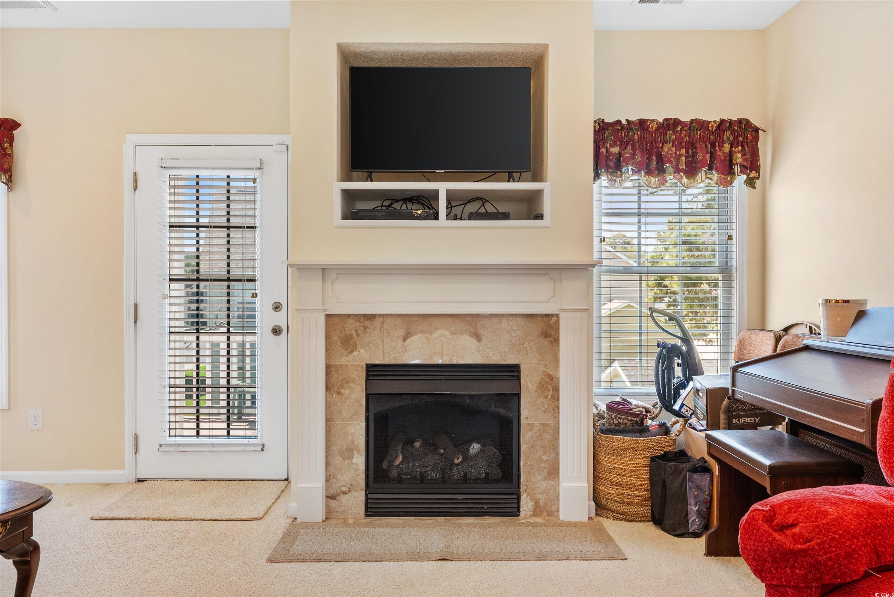 513 Rainbow Drive Murrells Inlet, SC 29576 - Photo 5 of 29 Living room featuring a fireplace and carpet floor